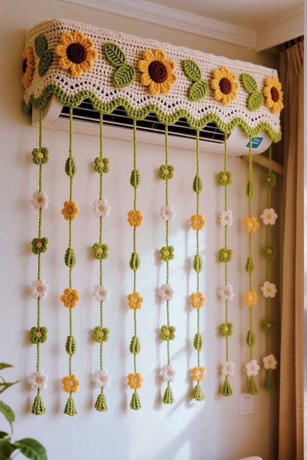 Crochet sunflower air conditioner cover with cream mesh stitches, yellow sunflowers, green